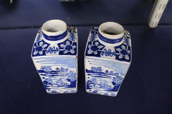 A pair of Dutch delft blue and white lidded tea caddies